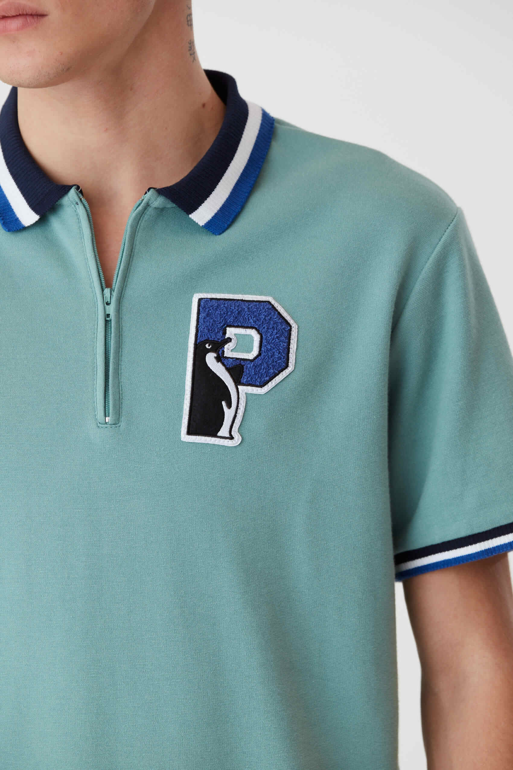 penguin_ss-p-patch-zip-stripe-cuff-polo_15-27-2024__picture-48301